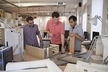 Architects reviewing models.